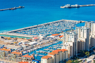 View of a marina in Gibraltar town and Bay of Gibraltar from The Upper Rock. UK