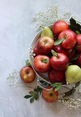Naklejka na ściany i meble Beautiful shiny red apples on a table. Still life with organic fruit. Healthy eating concept. 