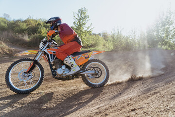 Man riding motorbike on motocross track.Extreme and Adrenaline. Motocross rider in action. Motocross sport. Active lifestyle