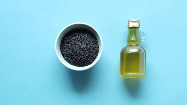 Black Cumin seed and oil in container 