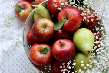 Beautiful shiny red apples on a table. Still life with organic fruit. Healthy eating concept. 