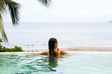 person in the pool woman happy holidays vacations tropical