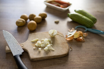 Fototapeta na wymiar Fresh chopped onion on wooden cutting board.