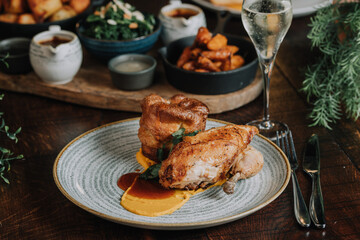 roast pork with potatoes and vegetables