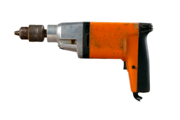 An old electric drill used in home workshops for minor repair work. Isolated background.