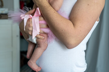 close-up of a young father and his newborn baby at home, loving parent with small daughter, happy father's day