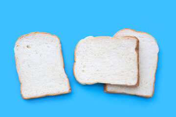 Sliced bread on blue background.