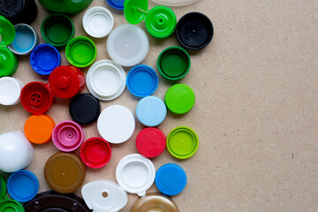 Colorful plastic bottle caps and plastic glass lid