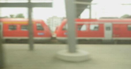 A view of a bustling railway platform in Germany, nobody present but the train ready for departure amidst public transport and travel