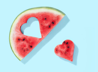 Fototapeta na wymiar Watermelon with heart on blue pastel background
