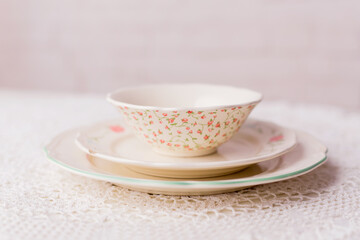 Closeup of porcelain plates and bowls