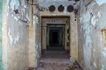 Fototapeta na wymiar Destroyed airlocks of a military secret abandoned bunker. Background
