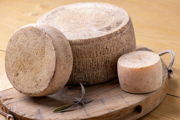 close up of maturated selection of cheese on old wood