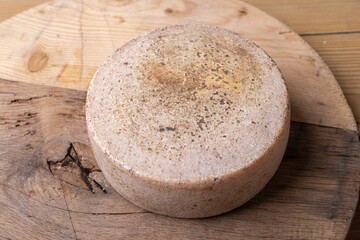 close up of maturated selection of cheese on old wood