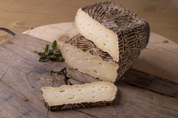 close up of maturated selection of cheese on old wood