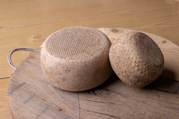 close up of maturated selection of cheese on old wood