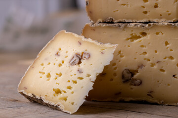 close up of maturated selection of cheese on old wood