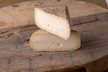 close up of maturated selection of cheese on old wood