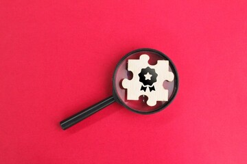 magnifying glass and puzzle with icons Quality Assurance, Assurance, Standards, ISO certification...