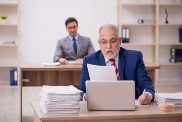 Two male colleagues sitting in the office