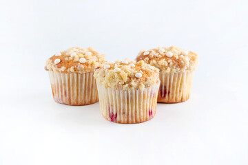 On a white background, muffins with streusel. Carbohydrate, gluten food.