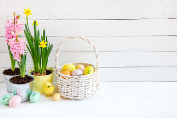 Easter background with Easter eggs and spring flowers