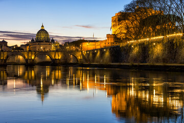 Fototapeta na wymiar Amazing day to night sunset of Rome, Italy, with the Ponte Sant'Angelo, the Tiber River with reflections on the water, the St. Peter's Basilica in the Vatican and Castel Sant'Angelo