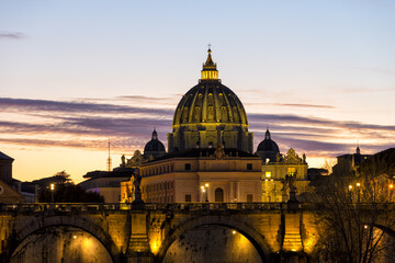 Fototapeta na wymiar View of St. Peter's Basilica in the Vatican, the Pope's church, from Via della Conciliazione at night with lights. Vatican Rome Italy Europe. The most beautiful place in the world