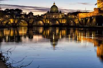 Incredible day to night sunset of Rome, Italy, with the Ponte Sant'Angelo, the River Tiber with...
