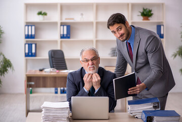 Two male colleagues working in the office