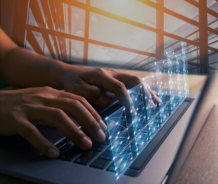 Abstract building and double exposure Businessman using the desktop laptop to plan strategic goals for industry growth, has virtual glow graph, market sector development concept, and team ideology.