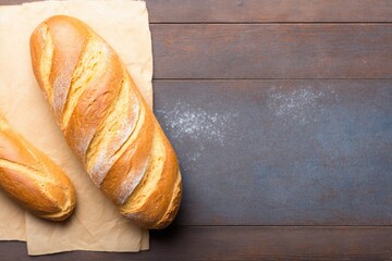 loaf of bread on wooden table, two freshly baked loaves, freshly baked bread on a wooden table
