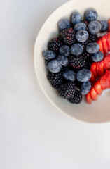 Sweet and Juicy: Delicious Red Berries on White Plate