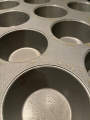 Greased metal muffin tins