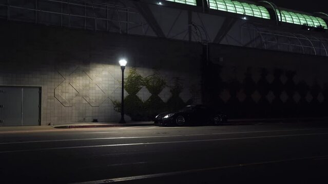 Parked under a street light at night