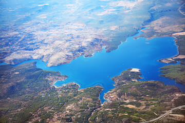 Fototapeta na wymiar Flight over water bay and mountains . Sibenik-Knin County Croatia