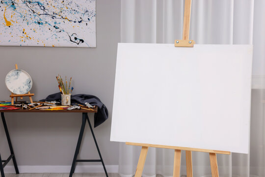 Wooden easel with canvas in artist's studio