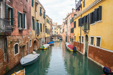 Fototapeta na wymiar Colorful houses, canal boats in Venice, Italy at winter. 