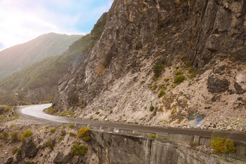 Picturesque view of empty road near mountains
