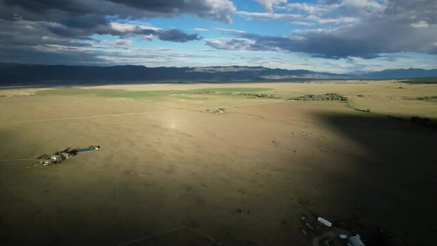 Sunset fly over the plains of Buena Vista, Colorado, near the Rocky Mountain National Park. Aerial 4K drone video