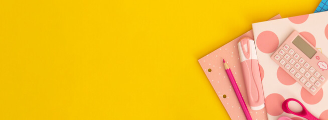 School stationery on a yellow background. Top view with copy space. Back to school concept.