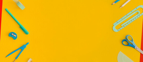 School stationery on a yellow background. Top view with copy space. Back to school concept.