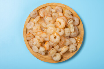 top view fresh cooked unskin shrimps on blue background horizontal composition