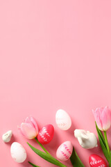 Happy Easter card template. Vertical banner with colorful Easter eggs, tulips, decorative bunnies on pink background