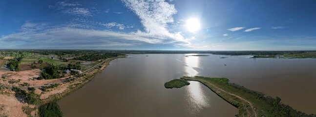 Obraz premium Panoramic view of beautiful lake with blue sky and sunlight, Sky background.