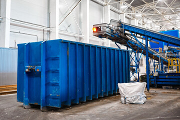 Large container and belt conveyors transporting garbage