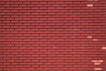 Solid red brick wall pink spots