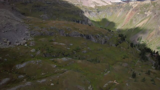 Governor Basin near Ouray, Colorado with Sneffels Mining District in the distance. Aerial 4K drone video in the Rocky Mountains.