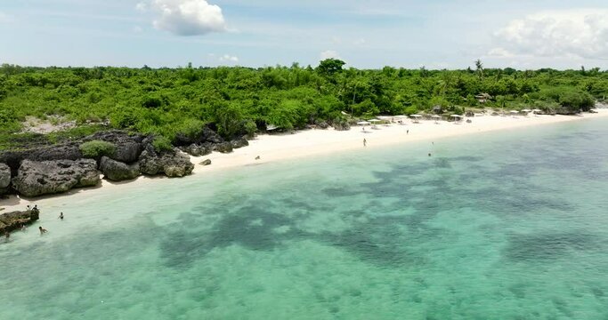 Tropical sandy beach and blue sea. Bantayan island, Philippines.