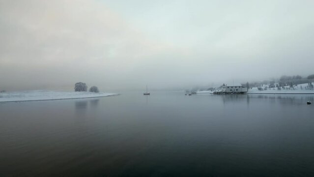Norwegian Fjord on foggy day, Kvaloya in Norway. Aerial drone view and sky for copy space